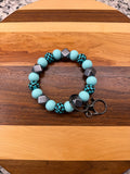 RTS - Teal Rush Check Wristlet